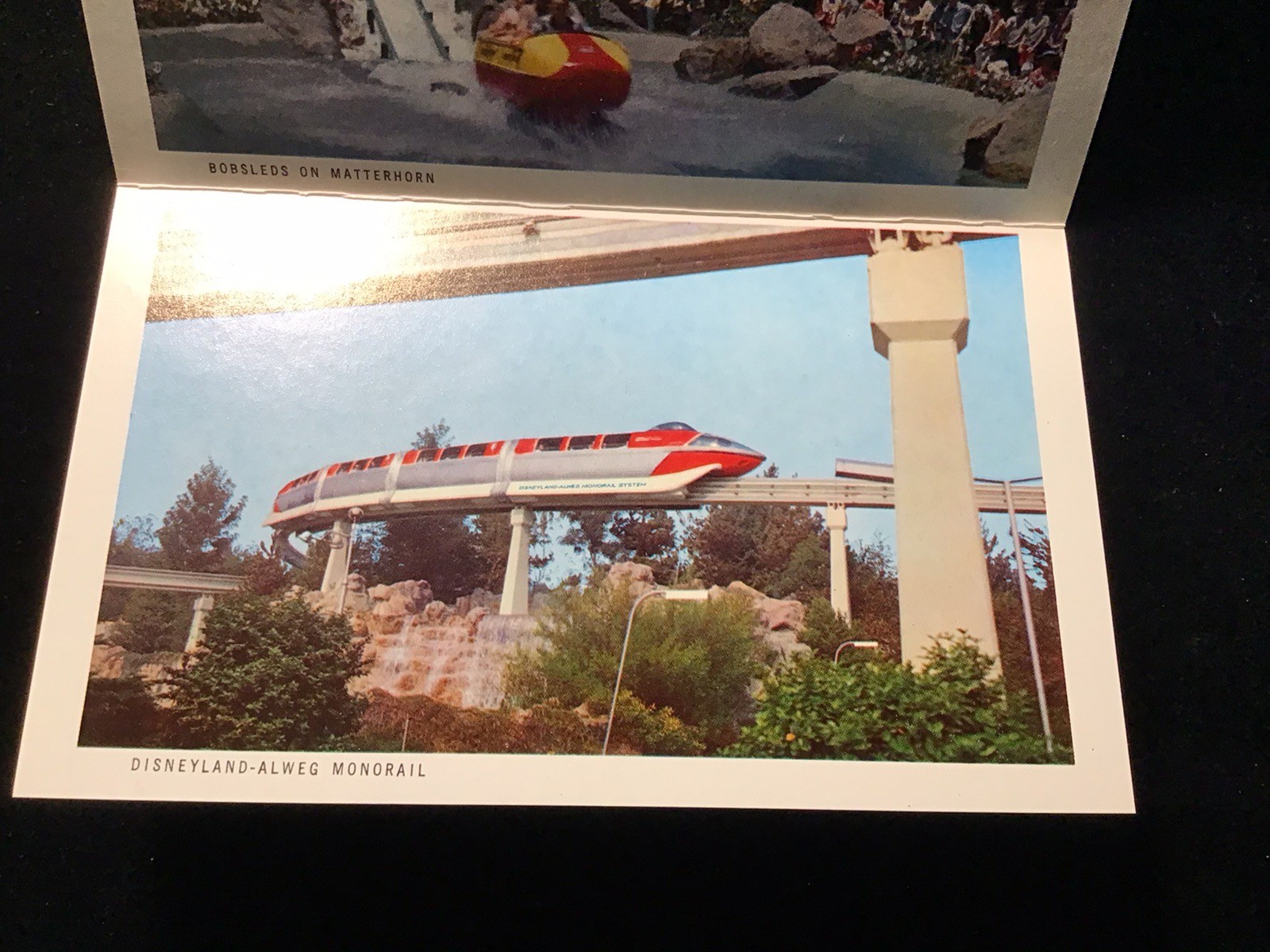 VTG WALT DISNEY DISNEYLAND POSTCARD FOLDER BOOKLET 12 VIEWS TOMORROWLAND RIDES