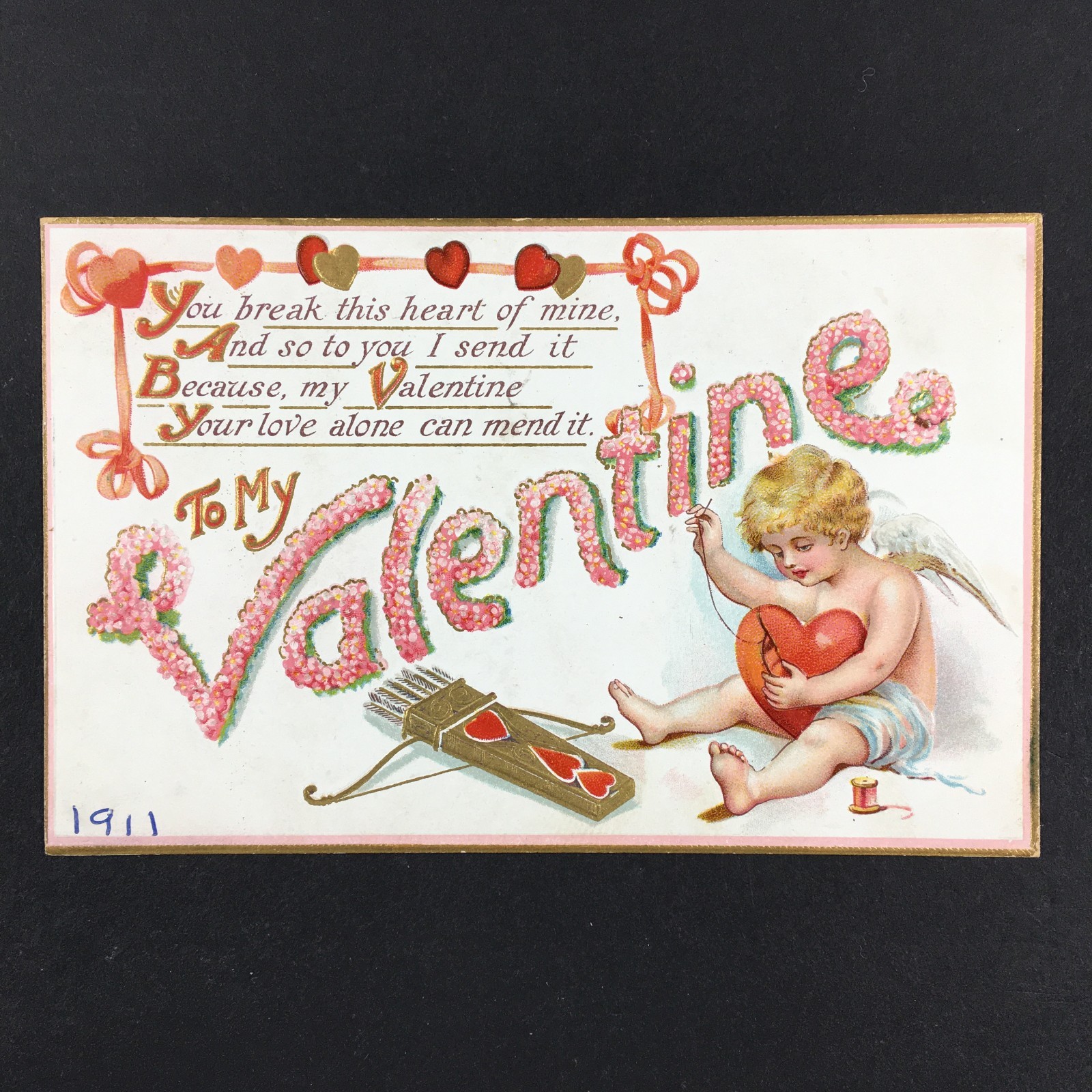 Antique Valentine’s Day Postcard Cupid Mending Sewing Heart Posted 1911