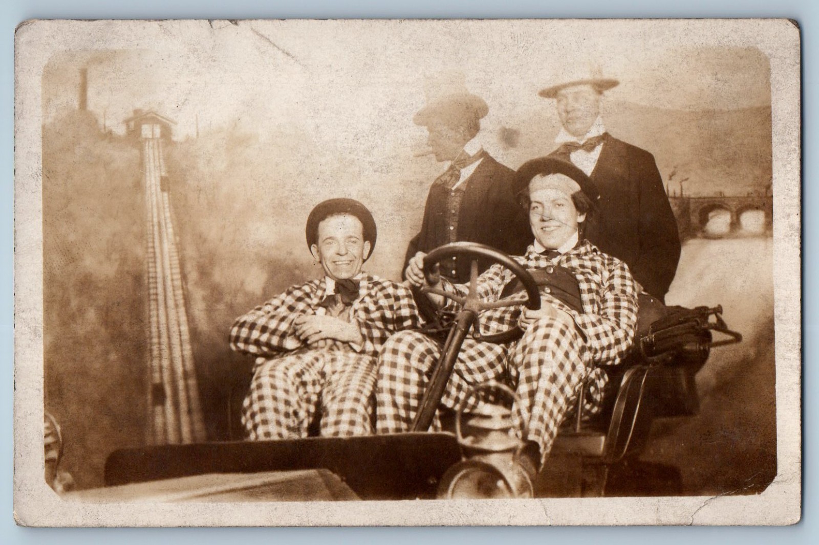 Men In Checkered Suits on Amusement Park Ride Studio Candid RPPC Photo Postcard