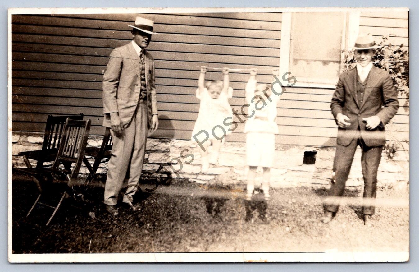 K58/ Interesting RPPC Postcard c1910 Boys Hanging From a Wire Weird 240
