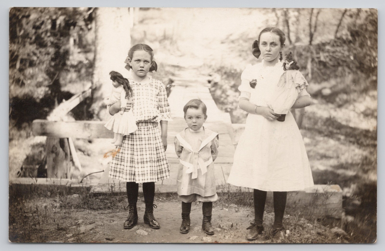 Real Photo Postcard c1910 Young Girls Holding Baby Dolls Creepy RPPC